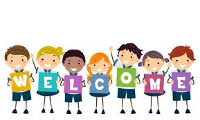 A row of children, each of them holding a letter to spell out the word welcome.